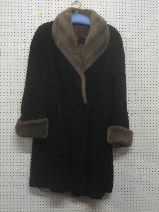 A lamb fur coat by Master Furriers