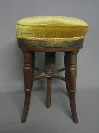 A circular William IV mahogany piano stool 