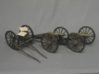 A pair of model field guns with 7" brass barrels, complete with limber