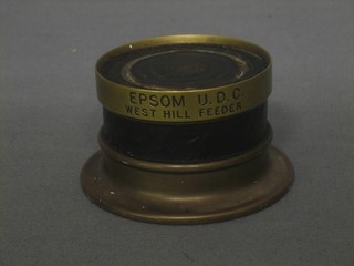 A section of telephone cable with brass mount marked Union Cable Limited Epsom UDC Westhill Feeder