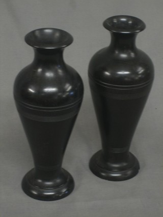 A pair of turned ebony club shaped vases 8"