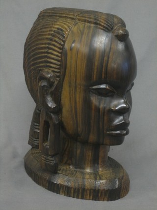 A carved African portrait bust of a lady 11"