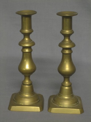 A pair of 19th Century brass candlesticks with ejectors 9"