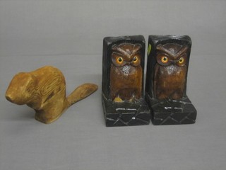 A carved figure of a Beaver 9" and a pair of carved wooden book ends