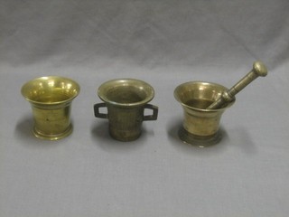 A 17th/18th Century bell metal mortar 4" together with 2 others and a pestle