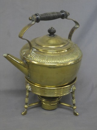 A Victorian brass tea kettle and stand complete with burner