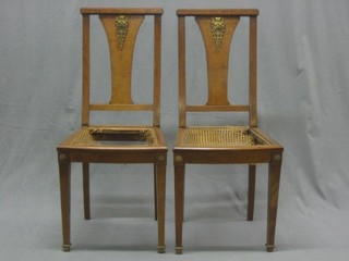 A set of 8 French figured walnut slat back dining chairs with gilt metal mounts and woven rush seats