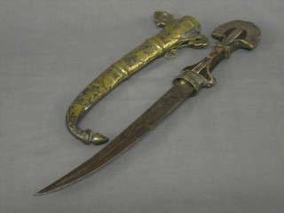 An Eastern Jambuka with 9" curved blade contained in a gilt scabbard