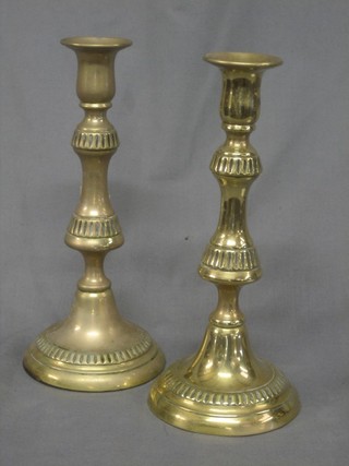 A pair of 19th Century brass candlesticks with ejectors 9"