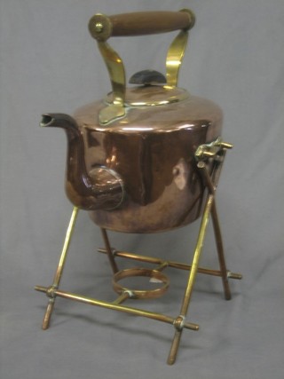 A 19th Century oval copper tea kettle raised on a brass stand (no burner)