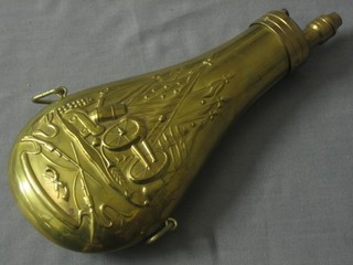 A reproduction American brass powder flask with embossed decoration
