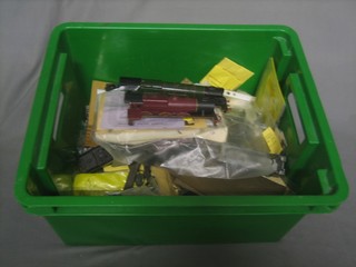 A box containing various metal railway models, some part made