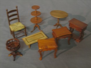 A collection of dolls house furniture comprising circular 3 tier dumb waiter, work table, pair of lamp tables, coffee table, wine table, oval occasional table and chair