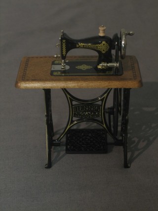 A dolls house Henig working treadle operated sewing machine 3"