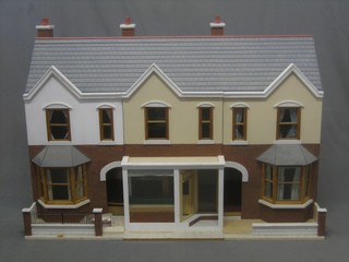 A dolls house in the form of a Victorian terrace house 46"