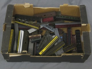 A collection of various plastic carriages, mostly f
