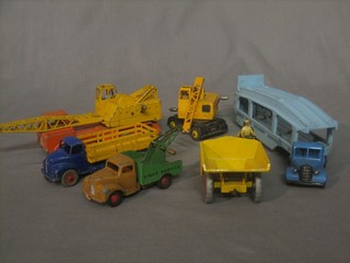 A Dinky Pulmore car transporter 582, a Dinky Muir-Hill dumper 562, a Dink 20 Ton lorry crane 972, a Dinky Coles mobile crane, do. Leyland Comet and a Commer