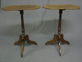 A pair of 19th Century bleached mahogany rectangular wine tables raised on pillar and tripod supports 24"
