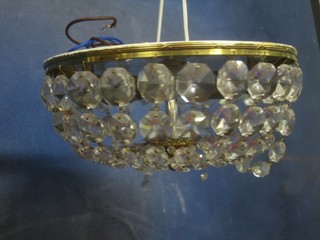 A pair of circular light fittings with cut lozenge decoration