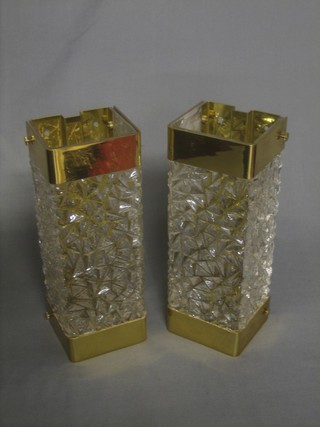A pair of gilt metal and glass wall lights