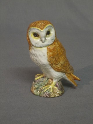 A Beswick figure of a seated owl, the base marked Beswick England 2026 4"
