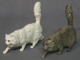 A Royal Doulton figure of a grey Persian cat and a white ditto 7"