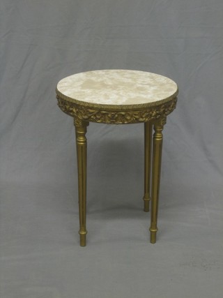 A circular gilt painted occasional table with faux marble top, raised on turned and fluted supports 16"