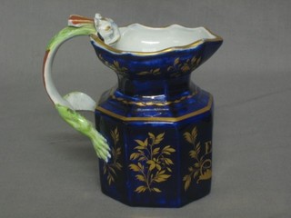 An Ironstone China octagonal jug, the handle in the form of a Dragon, blue glazed and with gilt floral decoration, marked Mifs Elener Hurst 5"
