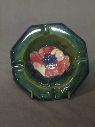 A circular Moorcroft ashtray decorated anemone, the reverse with incised Moorcroft signature and marked Potter to The Queen, 4"