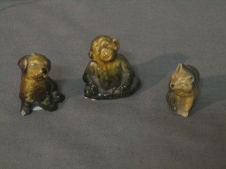 A Wade Whimsie model of a monkey and 2 ditto dogs