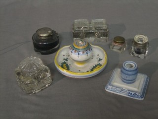 A faience style cylindrical pottery inkwell 5", a blue glazed inkwell in the form of a barrel and 5 various glass inkwells
