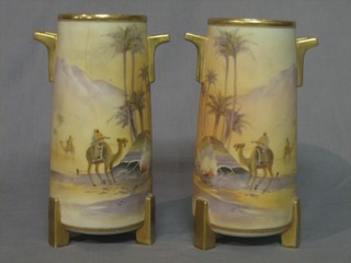 A pair of Noritake twin handled porcelain vases decorated Bedouin scenes 9" (1 cracked)
