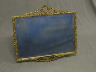 A  rectangular bevelled plate wall mirror contained in a decorative gilt frame surmounted by ribbon garland 22"