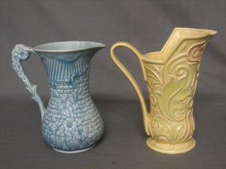 A Wade Gothic yellow glazed jug 9" and an Arthur Wood blue glazed jug 8"