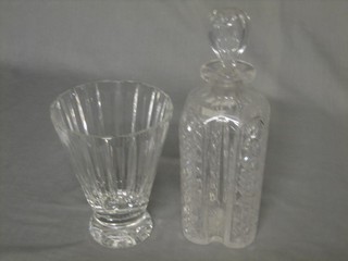 A faceted cut glass vase 7" and a shaped cut glass decanter and stopper