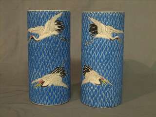 A pair of Oriental blue glazed cylindrical vases decorated storks 9 1/2"