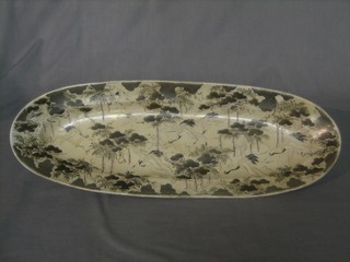 An oval Oriental porcelain dish decorated storks, the base with 3 character mark 21"