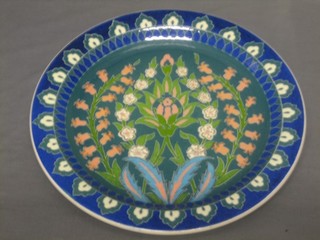 A Persian? circular pottery plate, the reverse marked  specially handmade Galari Cini 12"