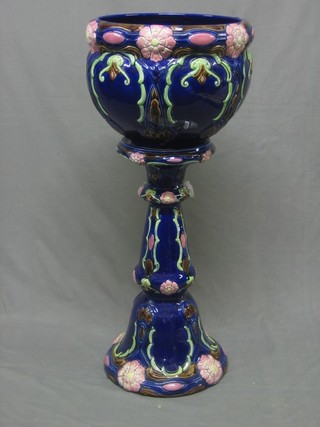 A blue glazed pottery jardiniere and stand