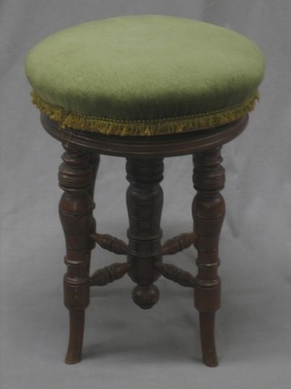 A Victorian mahogany revolving adjustable piano stool