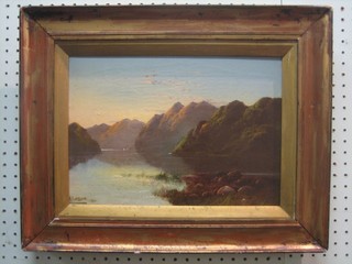 A Leslie, oil on canvas "Mountain Lake Scene" signed and dated 1910 (re-lined and patched) 9" x 13"