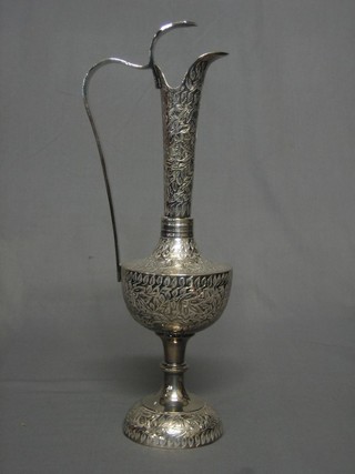 An Eastern engraved silver plated jug 14"