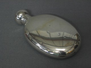 An oval silver hip flask 4", marks rubbed