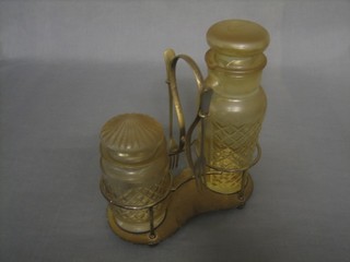 A silver plated twin bottle pickle stand containing 2 glass pickle jars