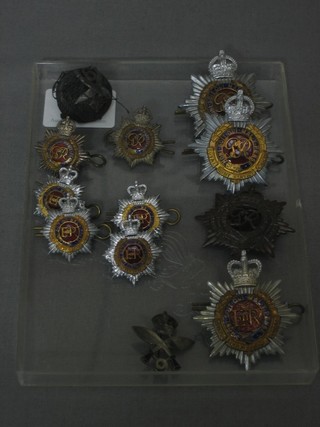 3 George VI Royal Army Service Corps Officer's cap badges, an Elizabeth II do., 6 pairs of collar dogs and 2 9th Ghurka Rifle cap badges