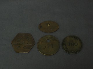 An LMS brass token marked LMS 567, 1 other L&NWRY, 1 other Great Northern Railways 160 and a GWR Railway services badge (pin f), the reverse marked J85770