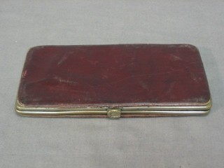 A 19th Century leather spectacle case with embroidered decoration 5"