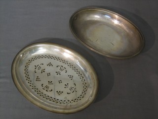 An oval silver plated entree dish insert