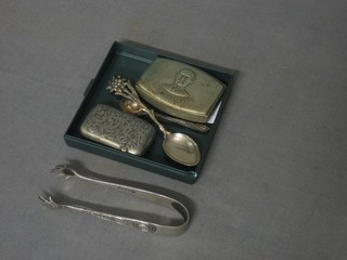 A white metal vesta case decorated General Bobs, a pair of plated tongs and 2 spoons