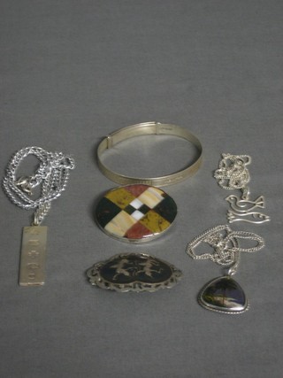 A silver ingot pendant, a silver bangle, a Thai silver brooch etc